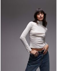 ASOS - Top Taglio Lungo Color Crema Trasparente A Collo Alto - Lyst