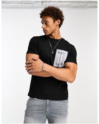 Calvin Klein - Concrete - t-shirt nera con stampa sul petto - Lyst