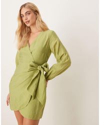 never fully dressed heart print wrap mini dress in black Avec Les Filles Women's Heart Patch Applique Mini Dress - Rinse Wash
