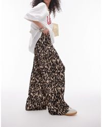 TOPSHOP - Pantaloni plissé stropicciati a fondo ampio marroni con stampa leopardata - Lyst