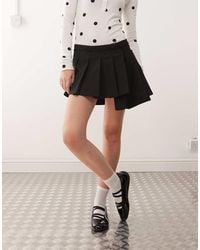 Monki - Pleated Mini Skirt With Asymmetric Hem - Lyst