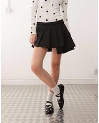 Monki - Pleated Mini Skirt With Asymmetric Hem - Lyst