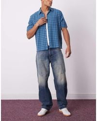 Weekday - Low Waist Loose Fit Barrel Leg Jeans With Dart Shaping - Lyst