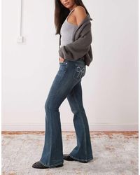 Monki - Vaqueros De Campana De Talle Bajo Con Lazos De Strass Katsumi De -Azul - Lyst
