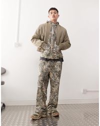 Collusion - – weite jogginghose mit baum-military-muster, kombiteil - Lyst
