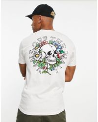 Vans - T-shirt bianca con stampa di teschio e fiori sul retro - Lyst
