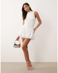 Aria Cove - Slinky High Neck Sleeveless Ruched Waist Ruffle Skirt Mini Dress - Lyst