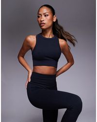 4505 - Seamless Baby Rib Racer Back High Neck Vest - Lyst