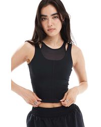 Nike - Camiseta Negra De Tirantes Con Diseño Superpuesto Dri-Fit De Nike One Training - Lyst