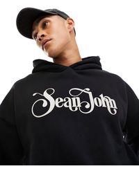 Sean John - Felpa nera con cappuccio e logo rétro stampato - Lyst
