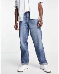 ASOS - Jeans extra larghi con cimosa lavaggio medio - Lyst