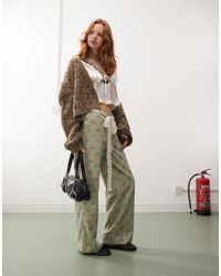 Reclaimed (vintage) - – weit geschnittene cordhose mit blumenmuster und bindegürtel aus spitze - Lyst