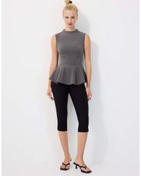 Stradivarius - High-neck Peplum Sleeveless Top - Lyst