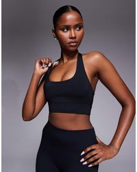 4505 - Active Halter Neck Performance Medium Support Sports Bra With Removable Padding - Lyst