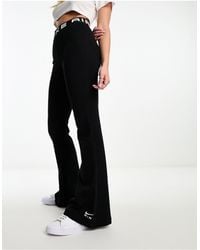 Nike - Air High Rise Flared Jersey Trousers - Lyst