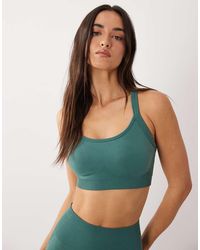 4505 - Sculpting Seamless Strappy Push Up Sports Bra With Removable Padding - Lyst