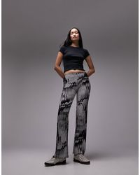 TOPSHOP - Pantalones s plisados con diseño estampado - Lyst