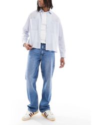 Lee Jeans - Vaqueros De Corte Suelto Recto Con Lavado Azul Medio Asher De - Lyst