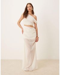 SNDY'S - – schulterfreies, transparentes maxikleid - Lyst