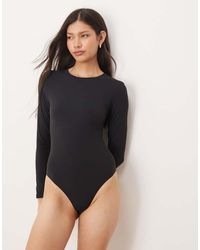 agon® - Long Sleeve Bodysuit - Lyst
