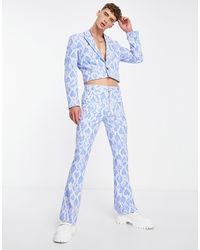 ASOS - Pantaloni da abito skinny a zampa blu effetto pitonato - Lyst