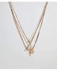 ASOS Collier multi-rangs avec pendentifs variés - Métallisé
