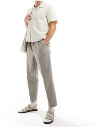 SELECTED - Pantalon ample raccourci à pinces - beige - Lyst