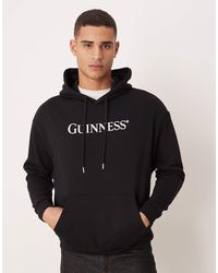 ASOS - Relaxed Hoodie With Guinness Print - Lyst
