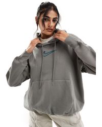 Nike - Sudadera gris oscuro unisex con capucha y logo mediano - Lyst