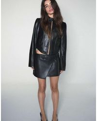 Stradivarius - Leather Effect Crossover Mini Skirt - Lyst