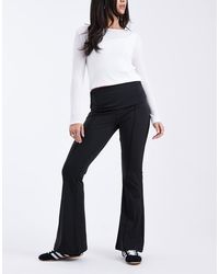 ASOS - Pantaloni Modellanti A Zampa Neri Con Risvolto - Lyst
