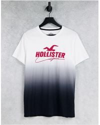 Hollister - T-shirt con logo frontale e stampa sfumata da bianca a nera - Lyst