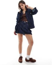 Levi's - Pleated Denim Mini Skirt - Lyst