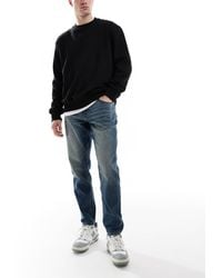 ASOS - Tapered Jeans With Vintage Tint - Lyst