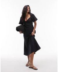 & Other Stories - Robe longueur mollet en lin à manches bouffantes et décolleté cœur torsadé - Lyst