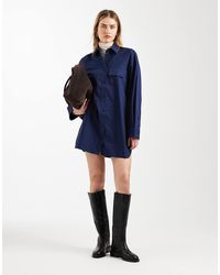 ASOS - Mini Overhemdjurk Met Lange Mouwen En Zakken Aan De Voorkant - Lyst