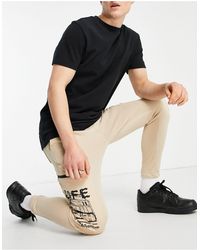 Bershka Cargo sweatpants With Printed Pockets - Brown