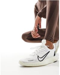 Nike - Free run nn - sneakers bianche e nere - Lyst