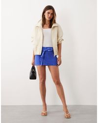 Mango - Starring Hailey Bieber 100% Cotton Tie Waist Denim Mini Skirt - Lyst