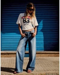 Bershka - Low-rise Crossover Waist Jeans - Lyst