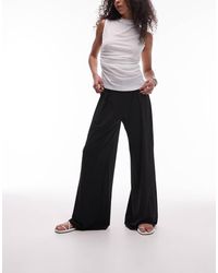 Mango - Stretch Broek Met Wijde Pijpen En Elastische Taille - Lyst