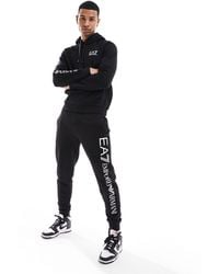 EA7 - Armani - - joggers della tuta neri con logo sulla gamba - Lyst