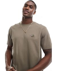 Hollister - T-shirt décontracté à imprimé logo - marron - Lyst
