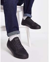 Levi's - Deacon - sneakers nere con linguetta rossa con logo - Lyst