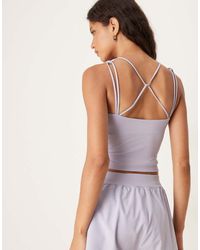 Tala - Camiseta Deportiva De Tirantes Con Detalle De Tiras Skinluxe De -Morado - Lyst