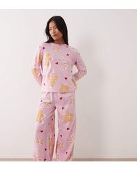 ASOS - Asos Design Petite Long Sleeve Top & Wide Leg Trouser Pyjama Set With Sweets Graphic - Lyst