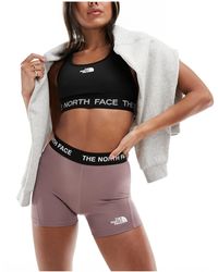 The North Face - Training - pantaloncini aderenti a vita alta grigi - Lyst