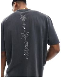 ASOS - T-shirt oversize pesante color slavato con stampa di simboli sulla schiena - Lyst