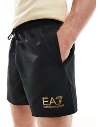 EA7 - Armani - pantaloncini da bagno neri con logo dorato - Lyst