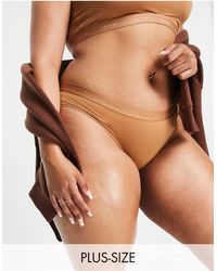 Calvin Klein - Plus - form to body - culotte style bikini à logo ton sur ton - bois - Lyst